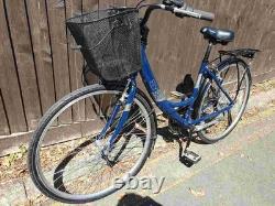 Aluminium Alloy Apollo Elyse Hybrid bike with a front basket, rear rack carrier