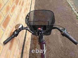Apollo Elyse Hybrid bike with a front basket, rear rack carrier, mudguards
