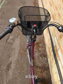 Apollo Elyse Hybrid bike with a front basket, rear rack carrier, mudguards