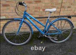 Trekker Freespirit Hybrid bike in good condition with a rear rack carrier, mudgu