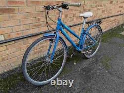 Trekker Freespirit Hybrid bike in good condition with a rear rack carrier, mudgu